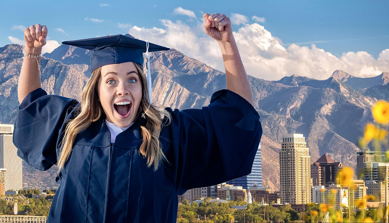 SLC Young woman in her graduation cap and gown showing excitement
