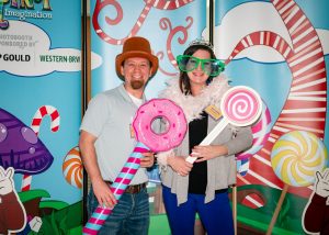 Relationship Manager, Amanda Catherell, and her boyfriend enjoying the photo booth and it's props. 